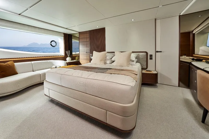  Yacht Photos Pics Luxurious bedroom interior of 2026 Princess Y80 yacht with ocean view.