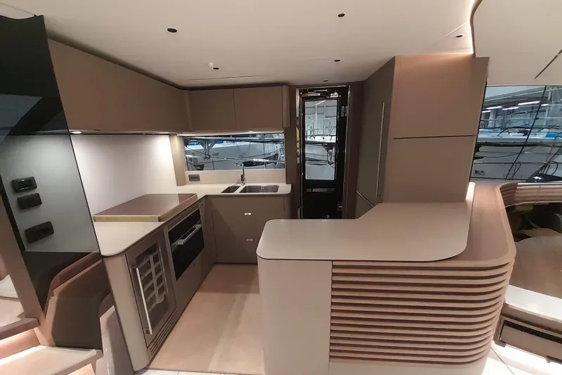  Yacht Photos Pics Modern kitchen interior of 2026 Princess Y80 yacht, featuring sleek design and high-end appliances.