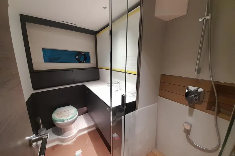  Yacht Photos Pics Modern bathroom in 2026 Princess Y80 yacht with shower and sleek design.