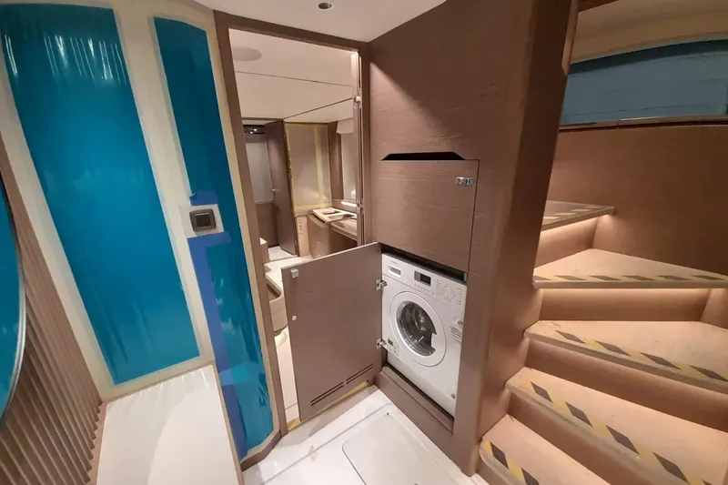  Yacht Photos Pics Modern interior of 2026 Princess Y80 yacht with integrated washing machine.
