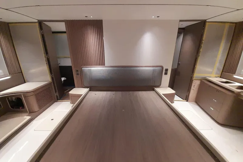  Yacht Photos Pics Luxurious interior of 2026 Princess Y80 yacht, featuring modern wood finishes and sleek design.