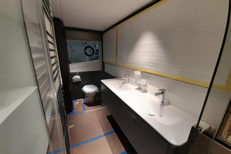  Yacht Photos Pics Luxury bathroom interior on Princess Y80 yacht, featuring dual sinks and modern fixtures, 2026 model.