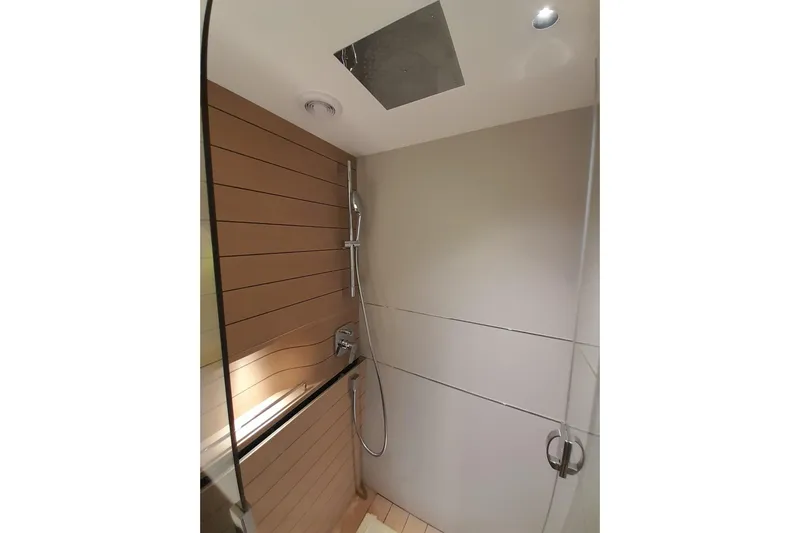  Yacht Photos Pics Modern shower area in 2026 Princess Y80 yacht with sleek design.