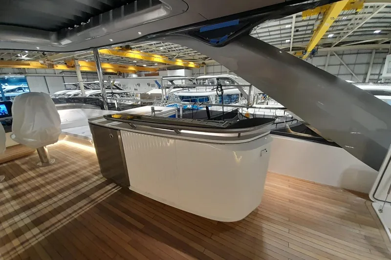  Yacht Photos Pics Luxury yacht interior with modern design, featuring a sleek bar area on the Princess Y80, 2026 model.