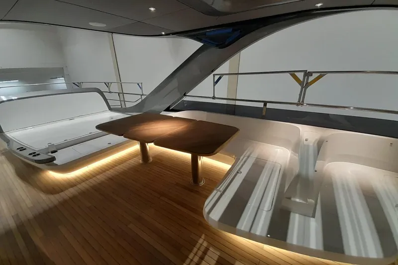  Yacht Photos Pics Luxurious interior of 2026 Princess Y80 yacht with elegant wood flooring and modern seating.