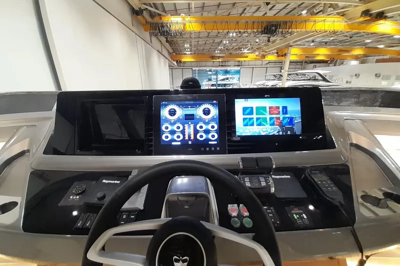  Yacht Photos Pics Control panel of 2026 Princess Y80 yacht with advanced navigation displays.