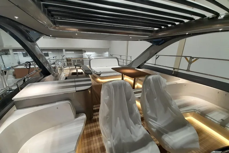  Yacht Photos Pics Luxurious interior of 2026 Princess Y80 yacht with modern seating and ambient lighting.