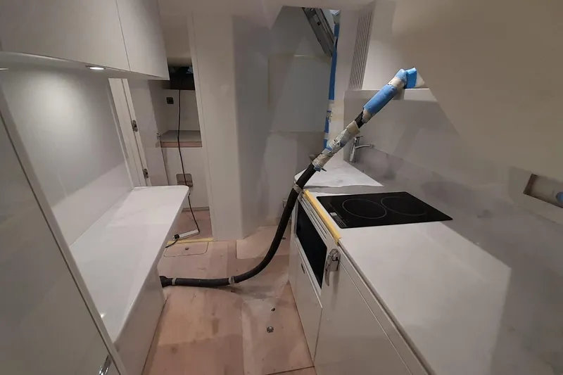  Yacht Photos Pics Modern kitchen interior of 2026 Princess Y80 yacht under construction.