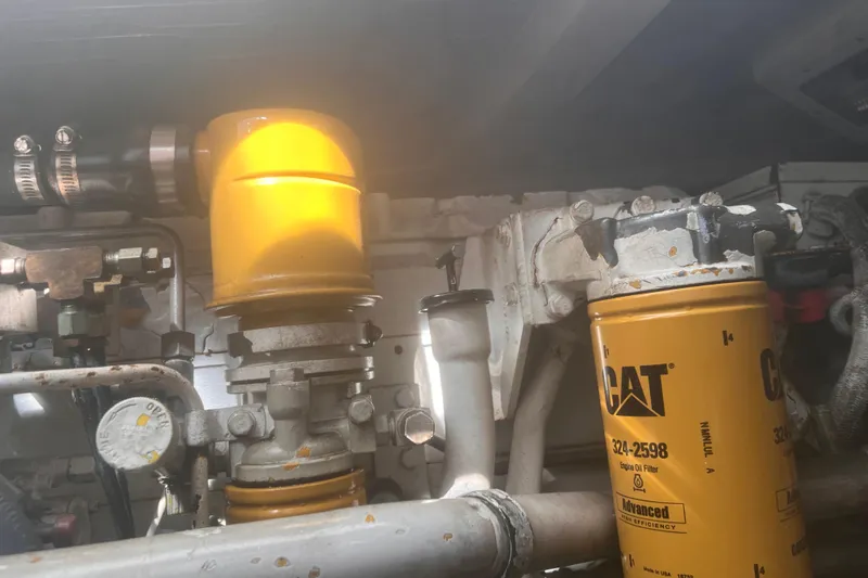 Unreel Yacht Photos Pics Engine components of a 2001 Cabo 31 Express boat, featuring CAT oil filters.