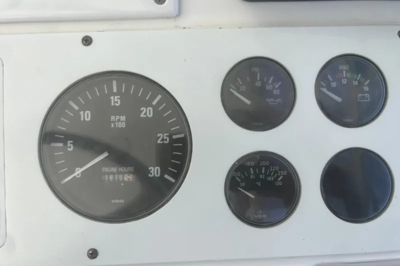Unreel Yacht Photos Pics Instrument panel of a 2001 Cabo 31 Express boat showing RPM and engine hours.