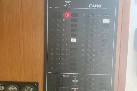 Unreel Yacht Photos Pics Electrical panel on a 2001 Cabo 31 Express boat with switches and gauges.