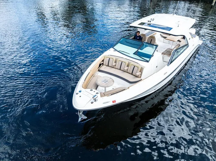  Yacht Photos Pics 2019 Sea Ray SLX 400 OB cruising on calm waters, showcasing luxury and style.
