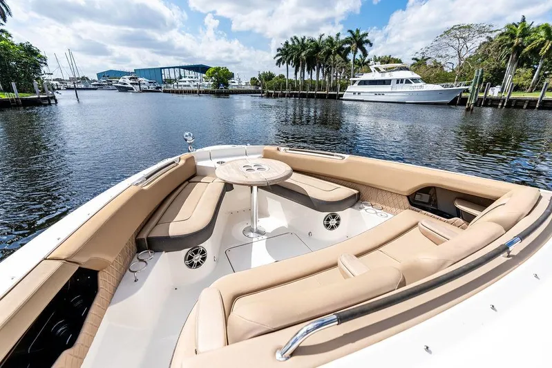  Yacht Photos Pics 2019 Sea Ray SLX 400 OB boat with luxurious seating on a scenic waterfront.