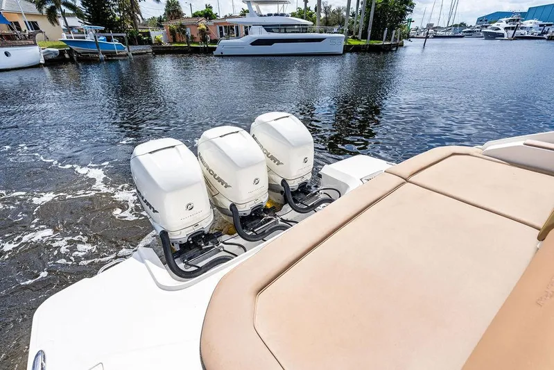  Yacht Photos Pics 2019 Sea Ray SLX 400 OB with triple outboard engines on a calm waterway.