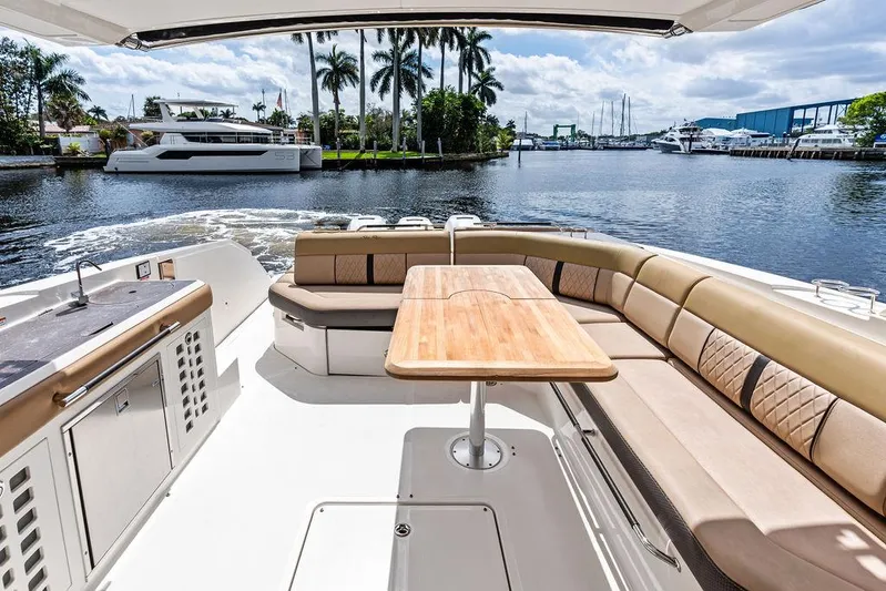  Yacht Photos Pics Luxurious 2019 Sea Ray SLX 400 OB boat interior with spacious seating and scenic waterway view.