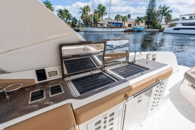  Yacht Photos Pics Outdoor kitchen on 2019 Sea Ray SLX 400 OB yacht with grill and scenic water view.