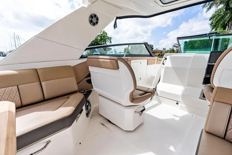  Yacht Photos Pics Luxurious interior of 2019 Sea Ray SLX 400 OB boat with beige seating.