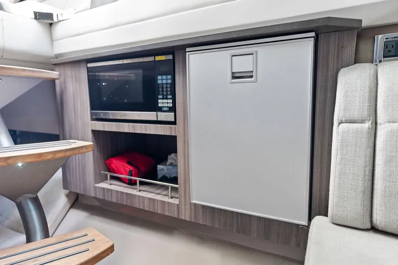 Yacht Photos Pics 2019 Sea Ray SLX 400 OB interior with microwave and storage cabinet.