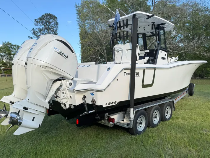  Yacht Photos Pics 2024 Tidewater 292 CC Adventure boat on trailer, featuring Yamaha outboard engines.