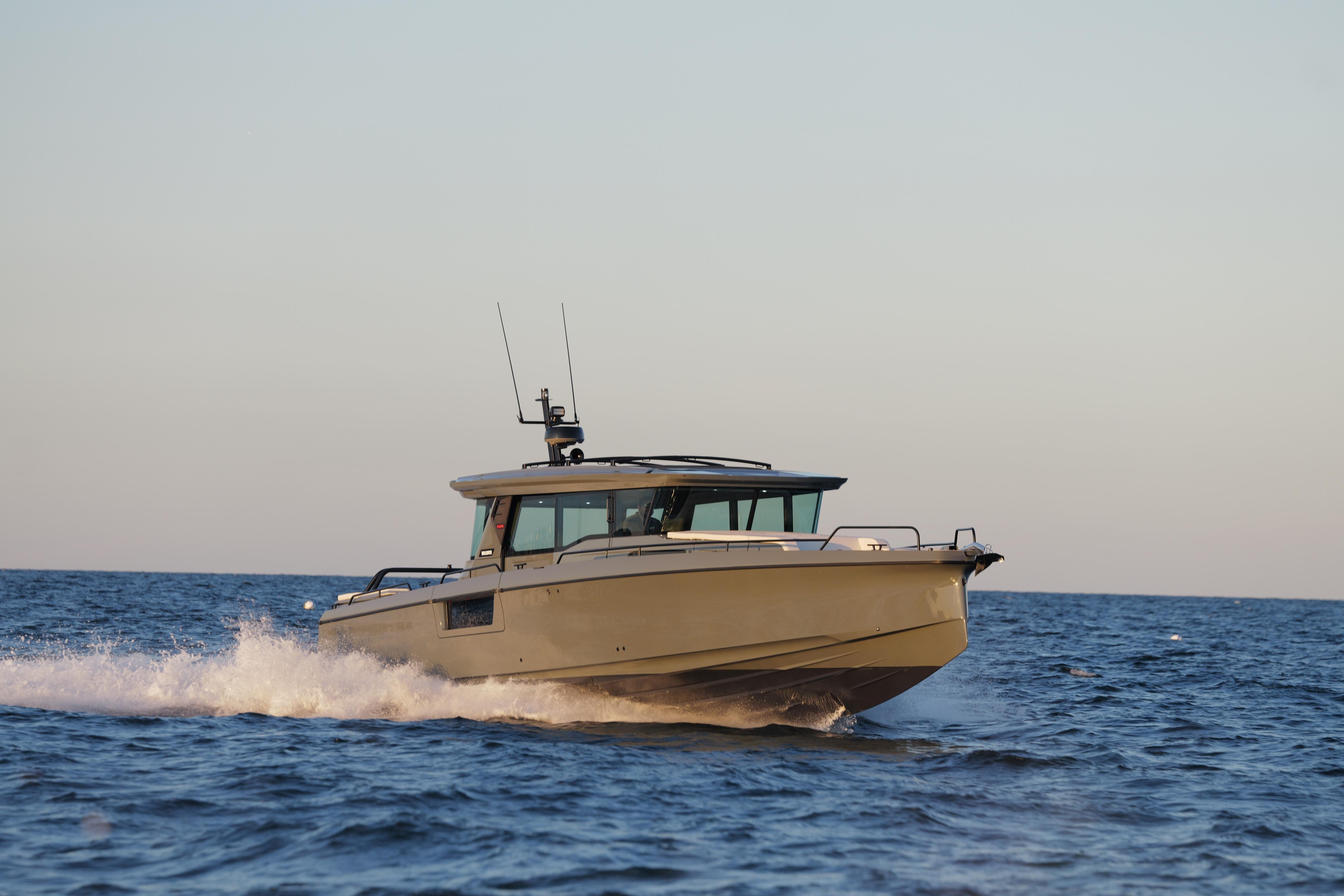 2026 BRABUS 1500 boat cruising on open sea at sunset.