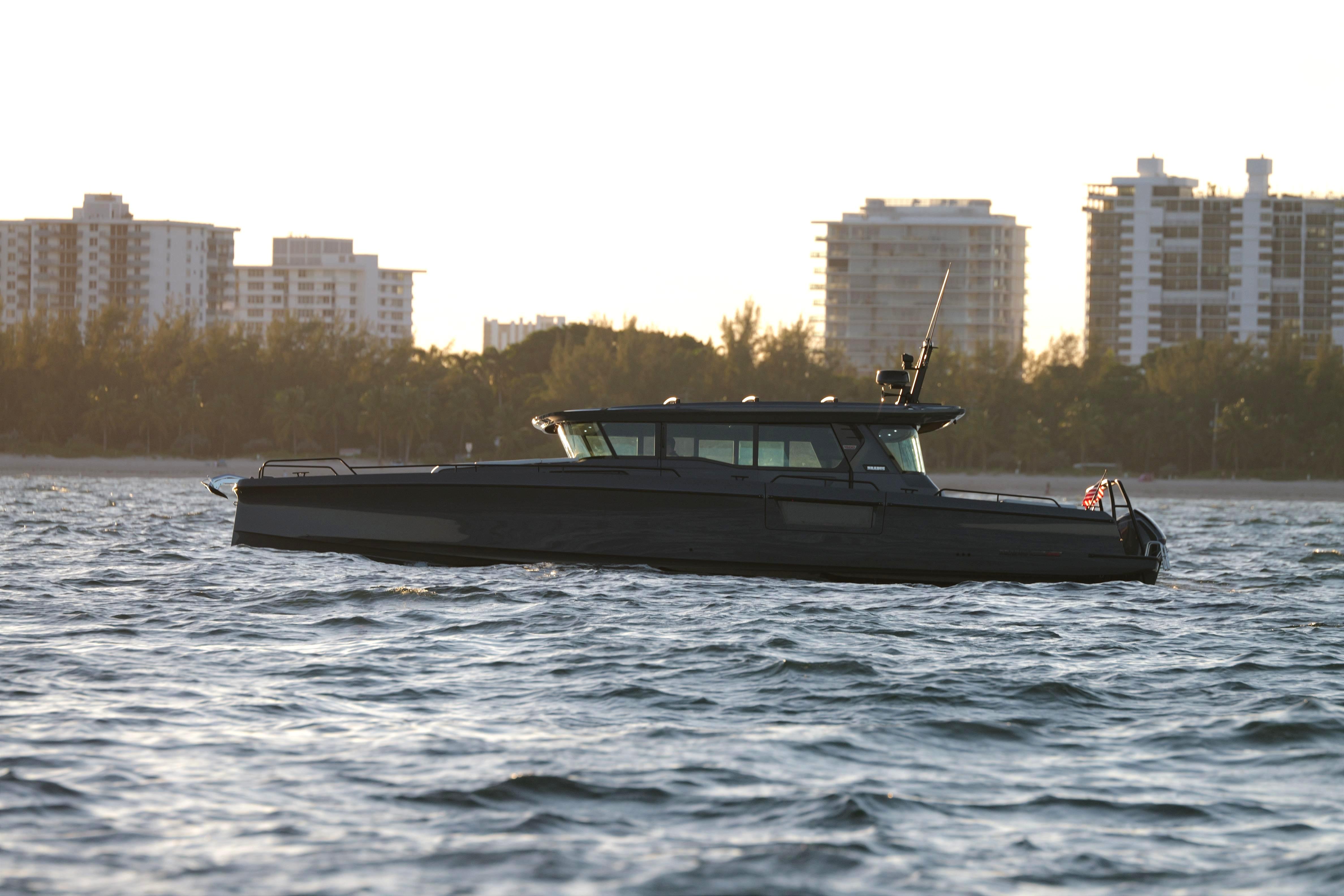 2026 BRABUS 1500 yacht cruising on water with city skyline in background.