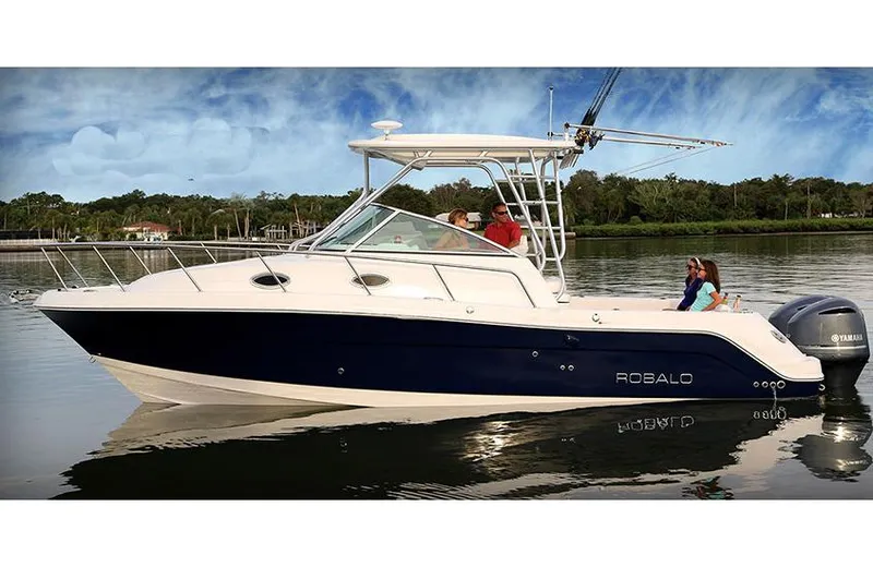  Yacht Photos Pics Manufacturer Provided Image: 2015 Robalo R305 Walkaround boat on calm water with passengers.