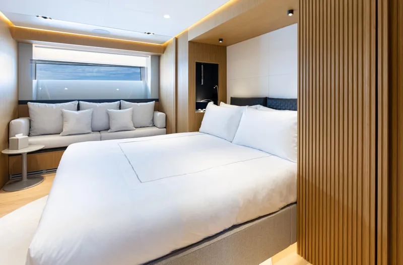 X99 Fast Yacht Photos Pics Luxurious bedroom in 2026 Extra X99 FAST yacht with modern design and cozy seating area.