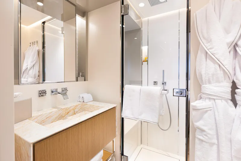 X99 Fast Yacht Photos Pics Modern bathroom with glass shower, marble sink, and bathrobes, Extra X99 FAST 2026.