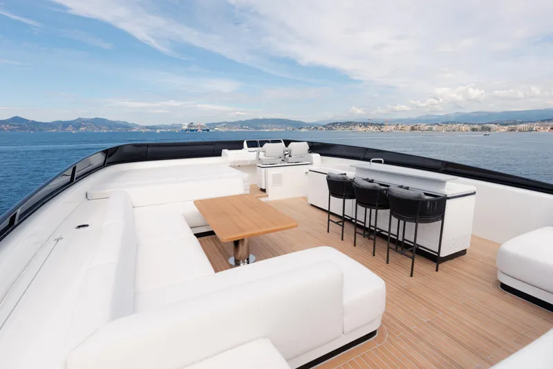 X99 Fast Yacht Photos Pics Luxurious deck of the 2026 Extra X99 FAST yacht with seating and bar area.