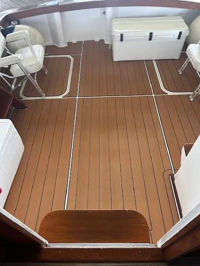  Yacht Photos Pics 1984 Post 43 Sport Fisherman boat deck with seating and storage.