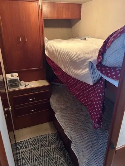  Yacht Photos Pics 1984 Post 43 Sport Fisherman cabin with bunk beds and wooden cabinetry.