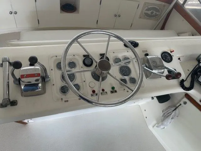 1984 Post 43 Sport Fisherman helm with steering wheel and control panel.