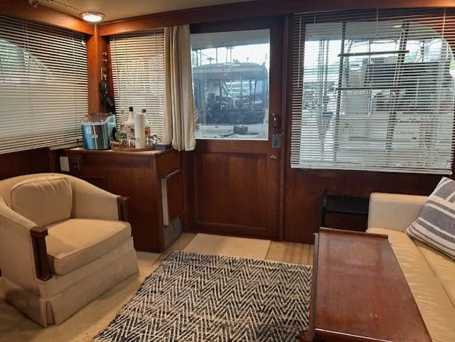  Yacht Photos Pics Interior of 1984 Post 43 Sport Fisherman yacht with cozy seating and wooden accents.