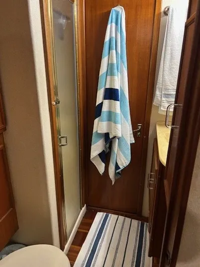  Yacht Photos Pics 1984 Post 43 Sport Fisherman bathroom with striped towel and shower.