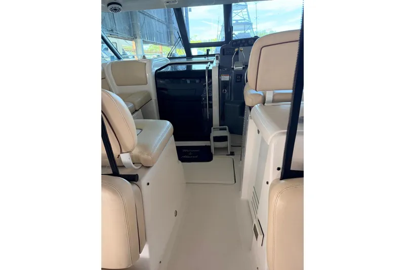  Yacht Photos Pics 2004 Tiara Yachts 3600 Sovran interior with beige seating and helm station.