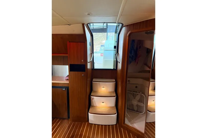  Yacht Photos Pics Interior of 2004 Tiara Yachts 3600 Sovran with wooden cabinetry and steps.