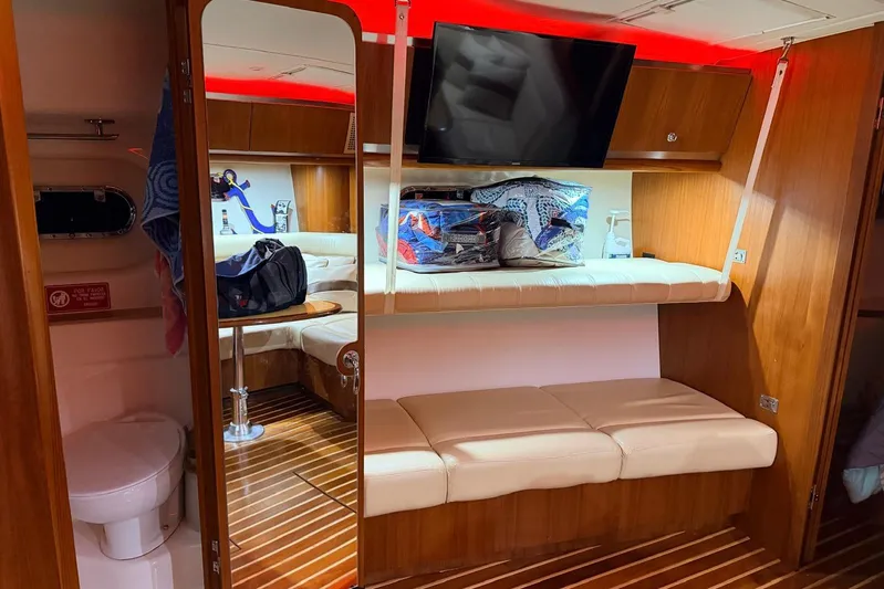  Yacht Photos Pics 2004 Tiara Yachts 3600 Sovran interior with cozy seating, TV, and wooden finishes.