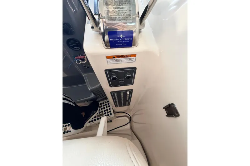  Yacht Photos Pics 2004 Tiara Yachts 3600 Sovran helm controls with warning label and switches.