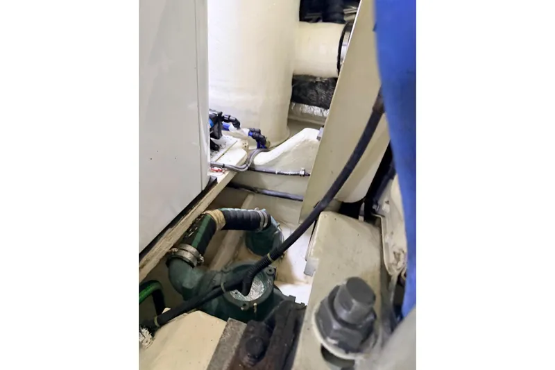  Yacht Photos Pics Engine compartment of 2004 Tiara Yachts 3600 Sovran with visible hoses and components.