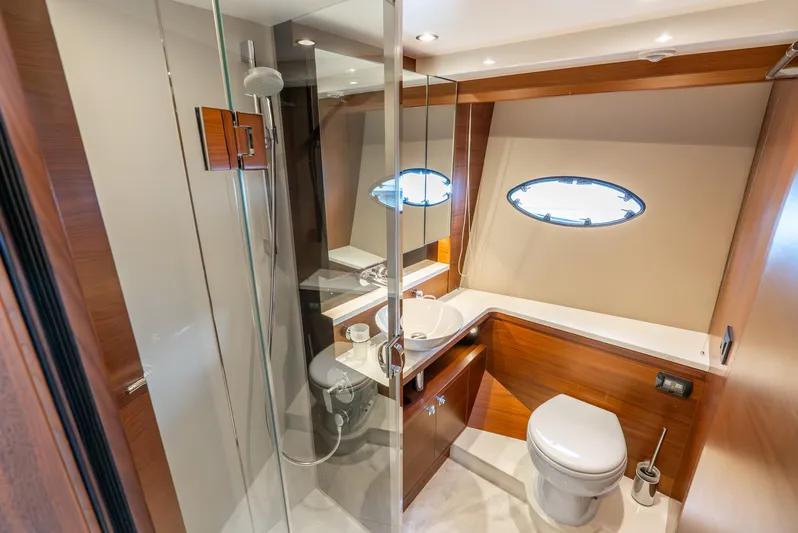 Mamu Yacht Photos Pics Luxurious bathroom in 2018 Princess F-68 yacht with modern fixtures and wood accents.