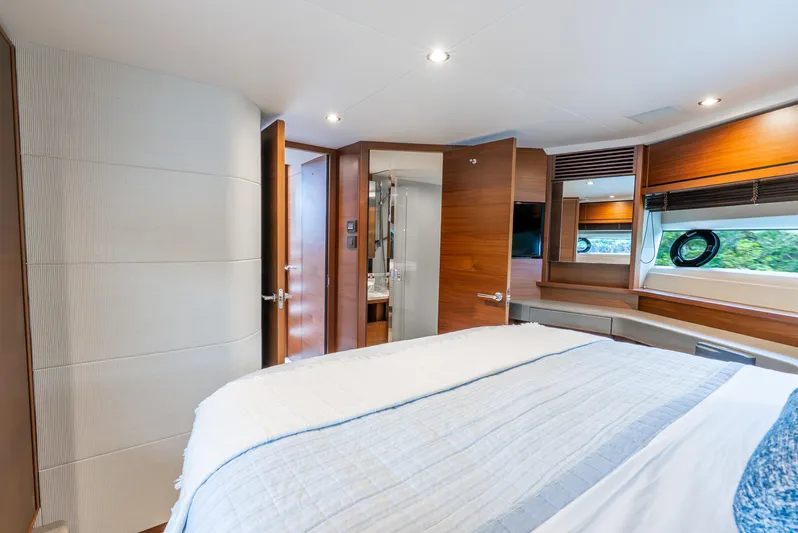 Mamu Yacht Photos Pics Luxurious bedroom interior of 2018 Princess F-68 yacht with modern design and wood accents.