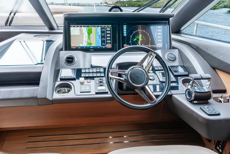 Mamu Yacht Photos Pics Cockpit of 2018 Princess F-68 yacht with advanced navigation systems and steering wheel.