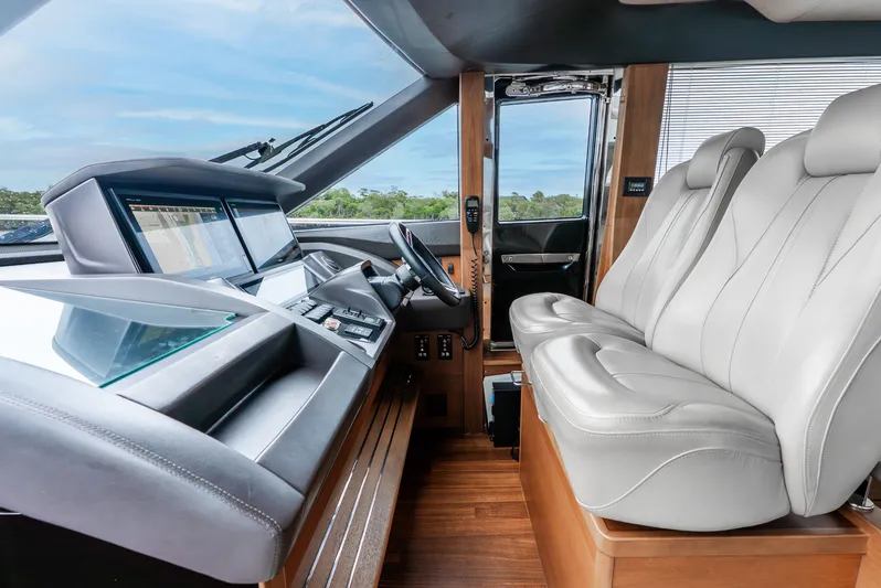Mamu Yacht Photos Pics Luxurious 2018 Princess F-68 yacht cockpit with modern controls and plush seating.
