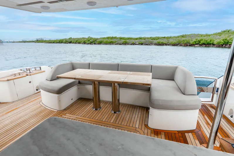 Mamu Yacht Photos Pics Luxurious 2018 Princess F-68 yacht deck with elegant seating and scenic water view.