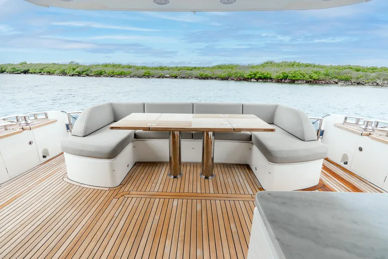 Mamu Yacht Photos Pics Luxurious 2018 Princess F-68 yacht deck with elegant seating and scenic water view.