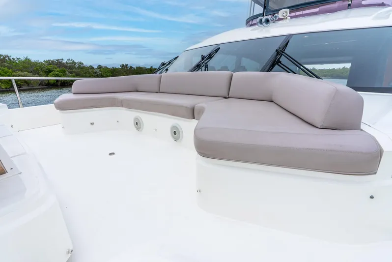 Mamu Yacht Photos Pics Luxurious seating area on 2018 Princess F-68 yacht, featuring plush cushions and sleek design.