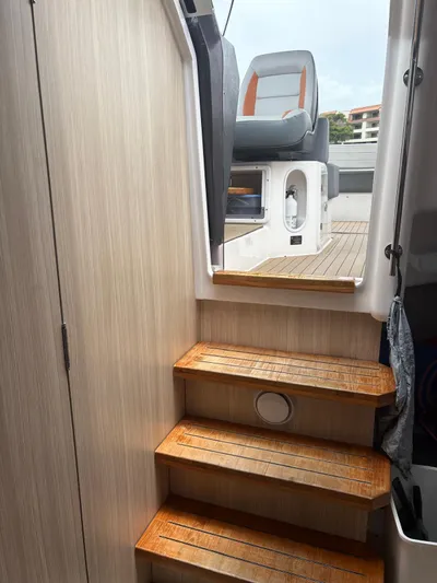  Yacht Photos Pics Interior view of 2023 Hanover 377 boat, featuring wooden steps leading to the deck.