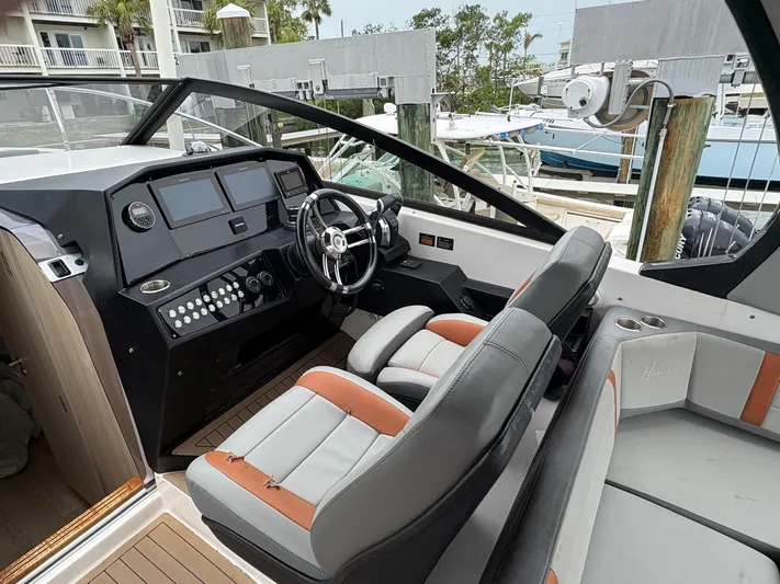  Yacht Photos Pics Interior of 2023 Hanover 377 boat with modern dashboard and seating.