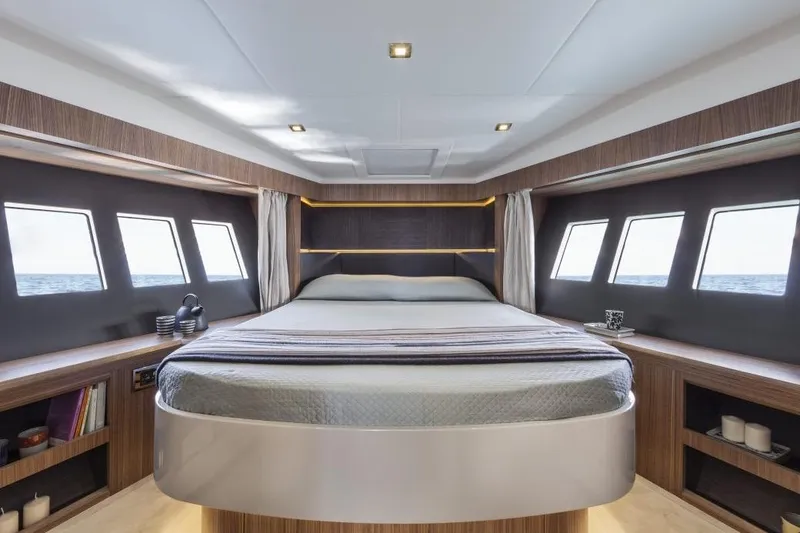 Marine Services S.a.s. Di Berruto Claudia Yacht Photos Pics Luxurious bedroom interior of 2015 Absolute 45 FLY yacht with ocean view windows.