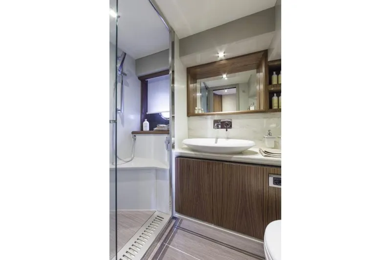 Marine Services S.a.s. Di Berruto Claudia Yacht Photos Pics Luxurious bathroom in 2015 Absolute 45 FLY yacht with modern fixtures and wood accents.